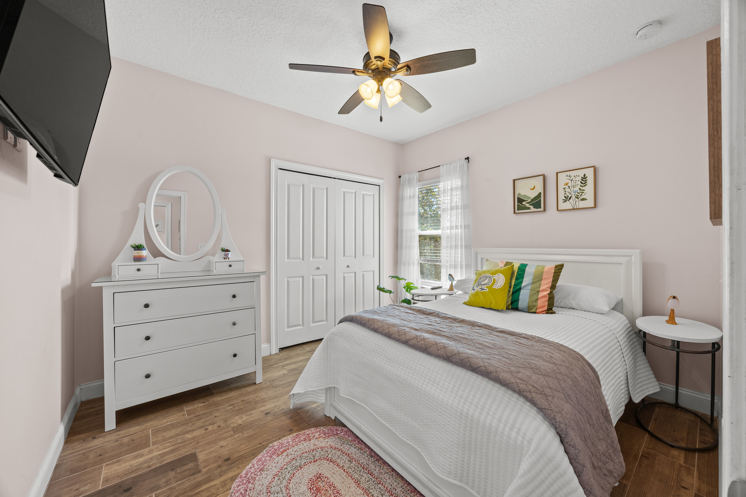 A cozy bedroom retreat with plenty of natural light and a comfy bed.  There is also a twin trundle that pulls out for extra sleeping.