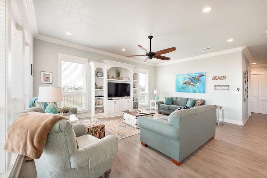 The heart of the home! This open living room offers comfortable seating, stylish décor, and a bright, breezy atmosphere, ideal for movie nights, morning coffee, or quality time together.