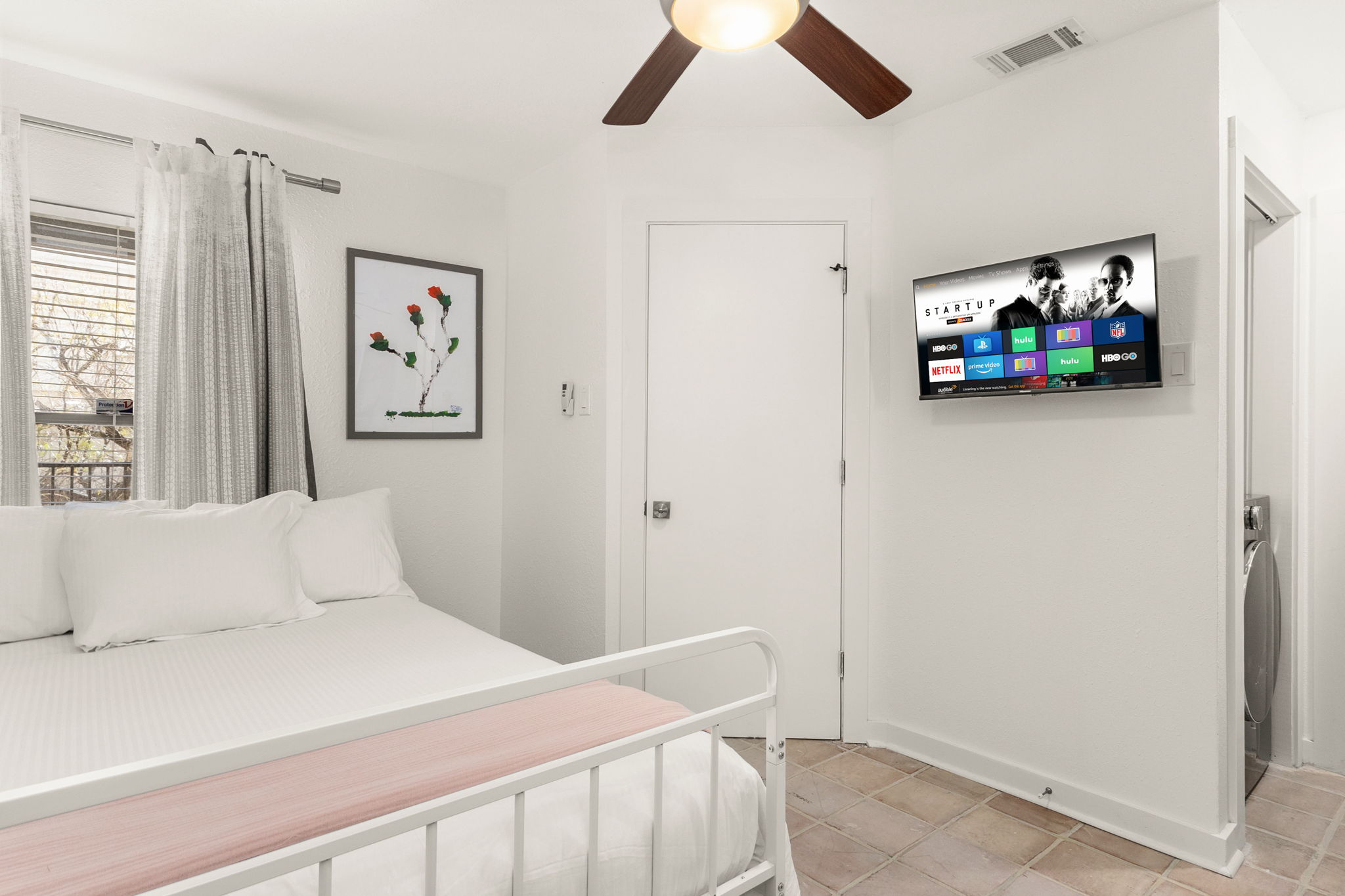 Downstairs bedroom with ensuite bathroom and laundry facilities.