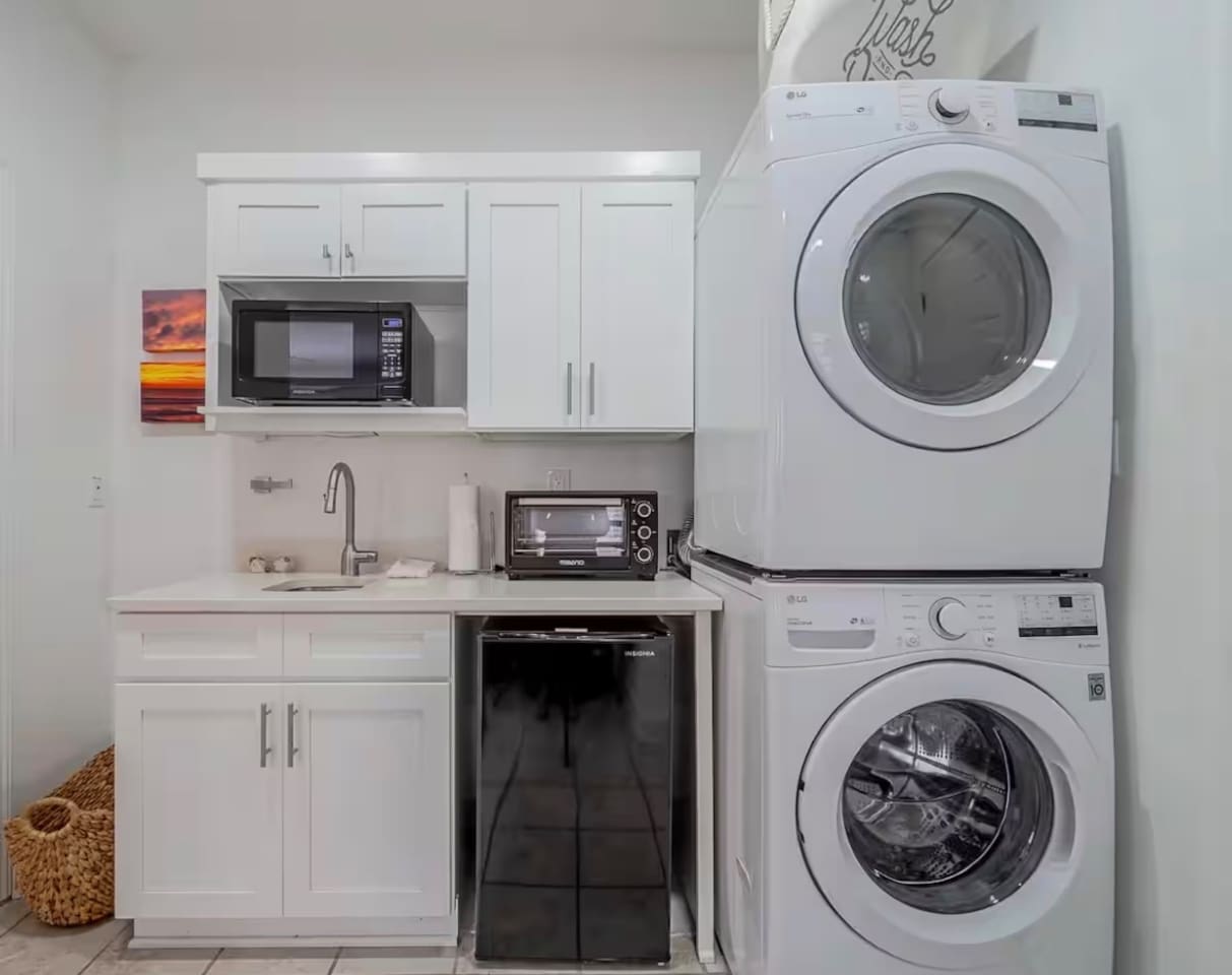 Kitchenette on bottom floor with 2nd laundry set in the bunk room area