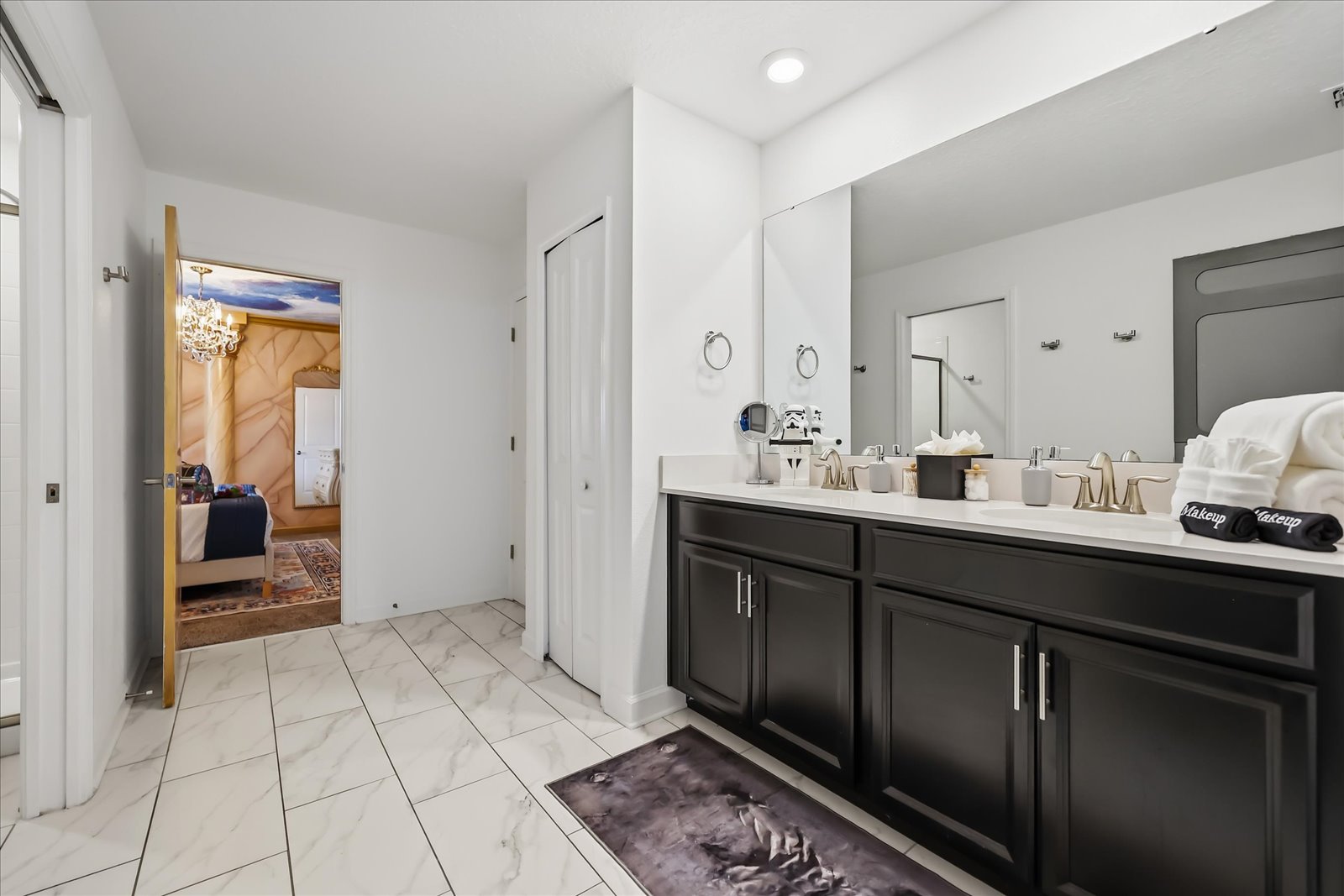 Bathroom shared by Star Wars and Beauty & the Beast bedrooms with an additional hall access door.