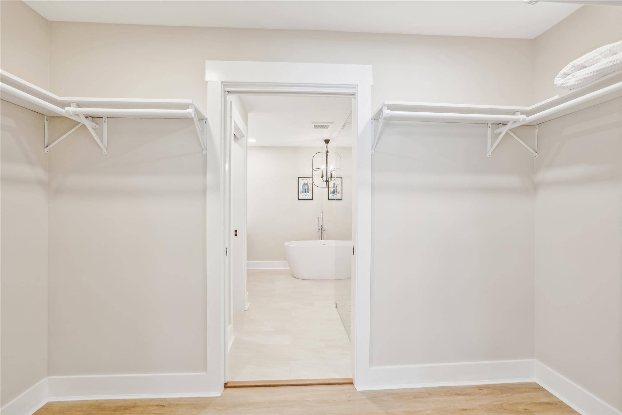 Primary Bedroom closet that connects primary bathroom