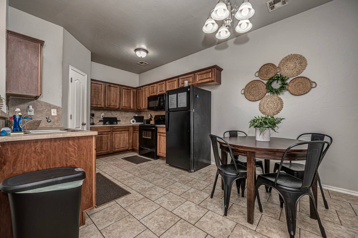 Spacious kitchen with seating for four—perfect for meals or game nights.