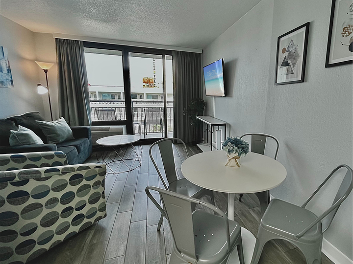 Indulge in beachfront bliss in our suite. Boasting a comfortable couch in the living area, providing the ultimate coastal comfort.