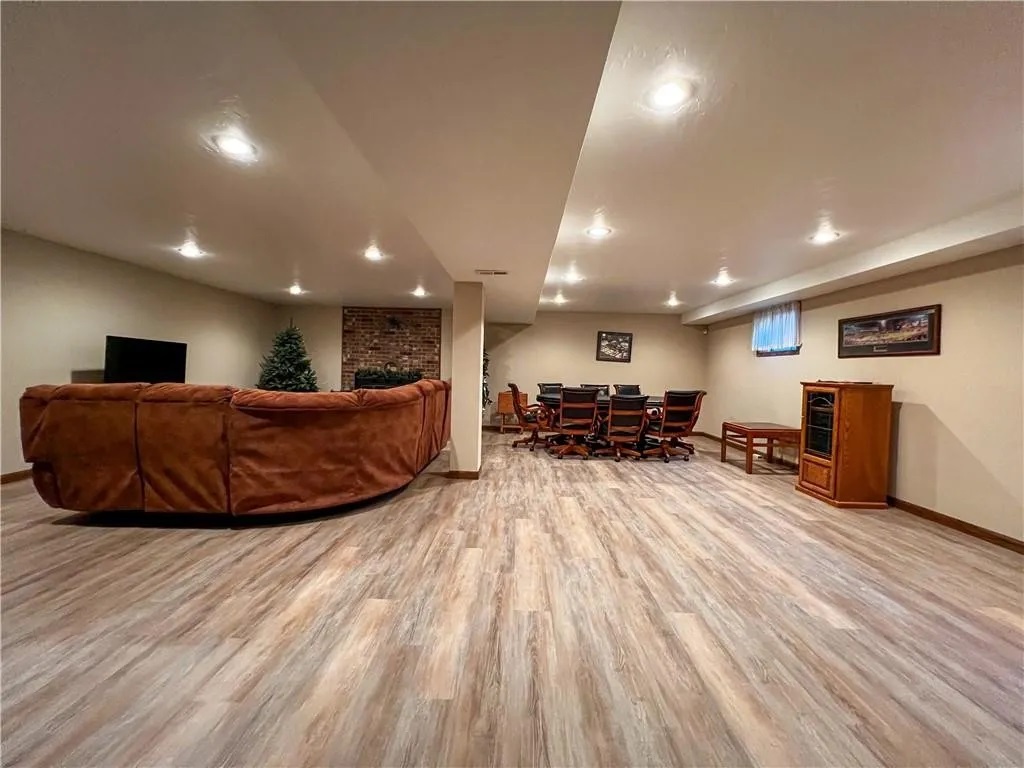 This expansive lower-level area offers plenty of room to relax, gather, or enjoy group activities. With comfortable seating and an open layout, it’s perfect for unwinding without feeling crowded.