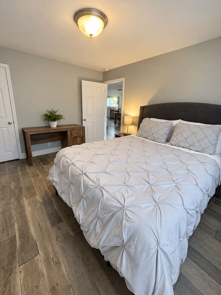 Bedroom Oasis: Relax in style with modern decor, natural light, and a serene atmosphere!