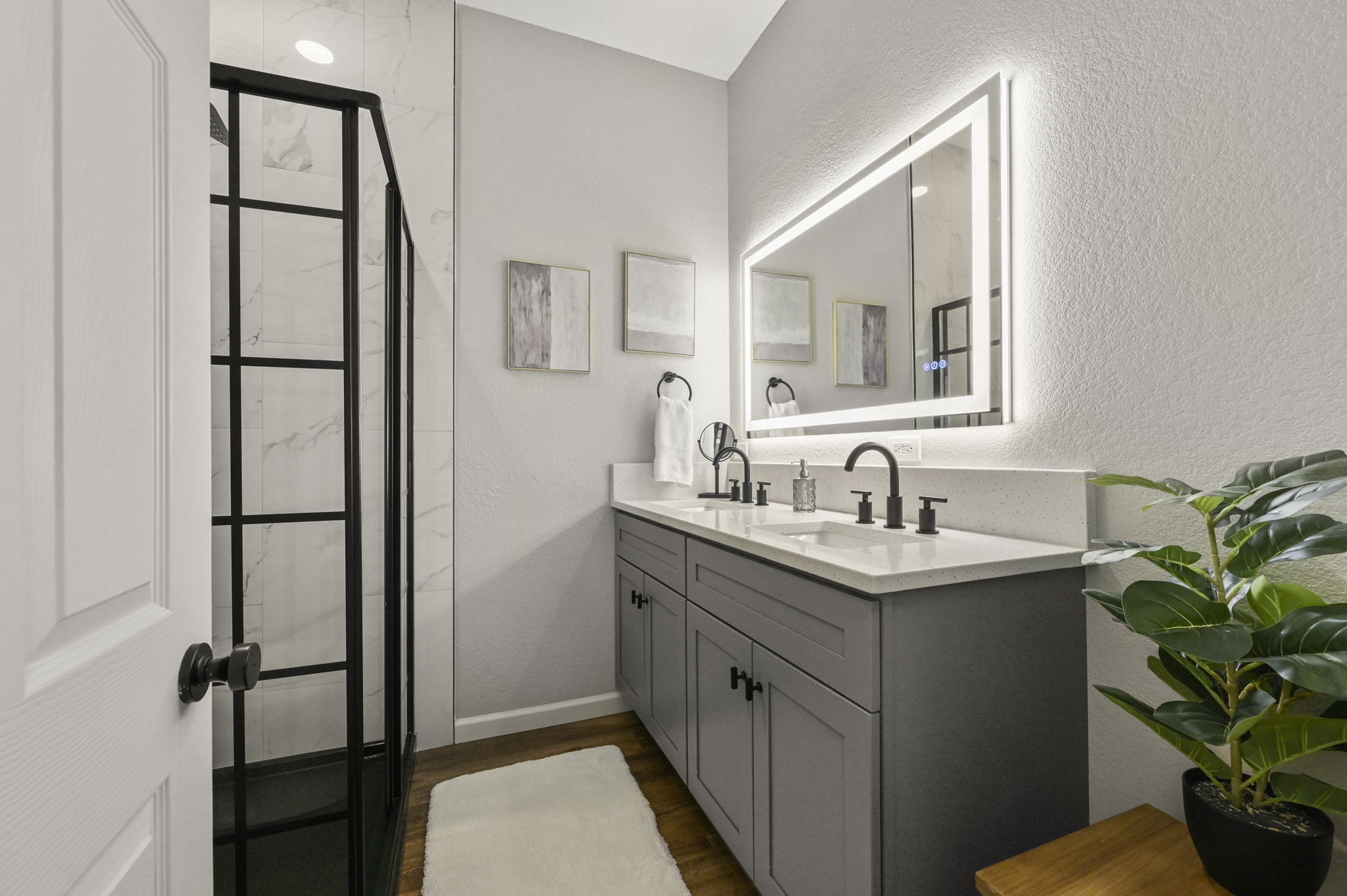 Bedroom 4 shares a spa-like, modern bath with Bedroom 3