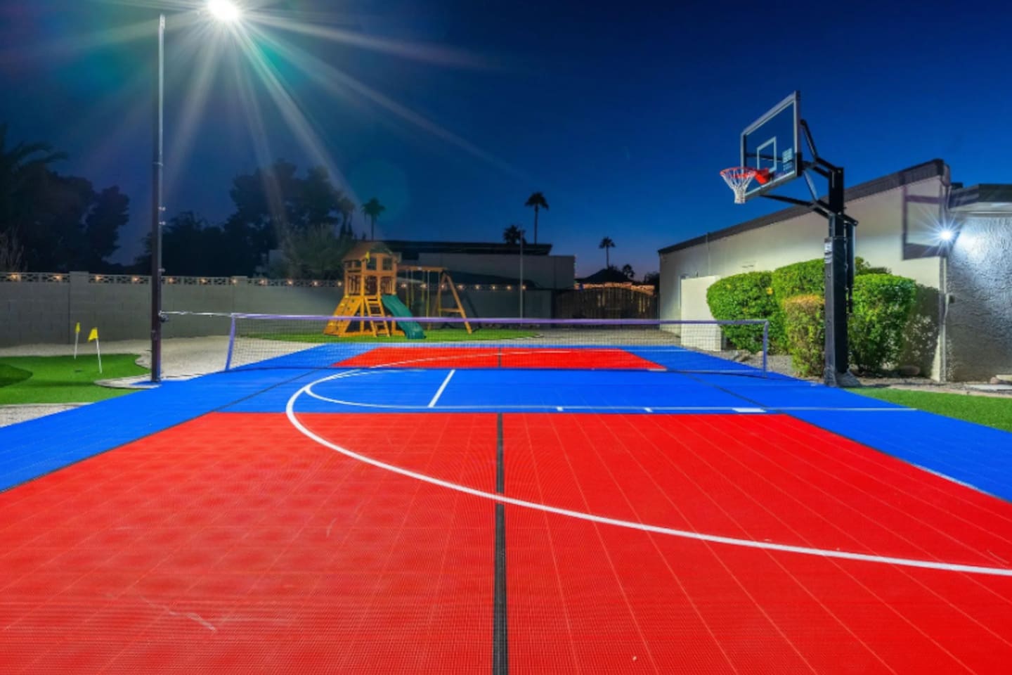 Under the lights, the sport court takes on a whole new energy, perfect for a game that runs past sundown.
