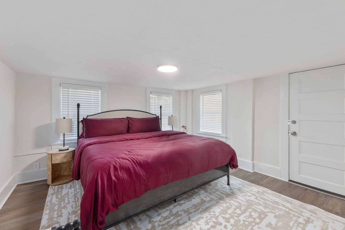 King-sized bed in one of the downstairs bedrooms.