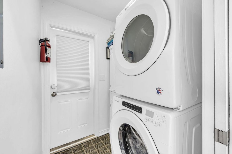Laundry Room w/ full washer/dryer combo and pocket door for noise control!