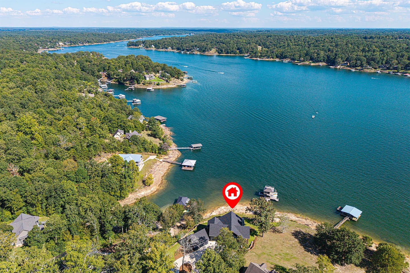 From above, you can see how peaceful it is — your own slice of shoreline surrounded by calm blue water and endless trees.