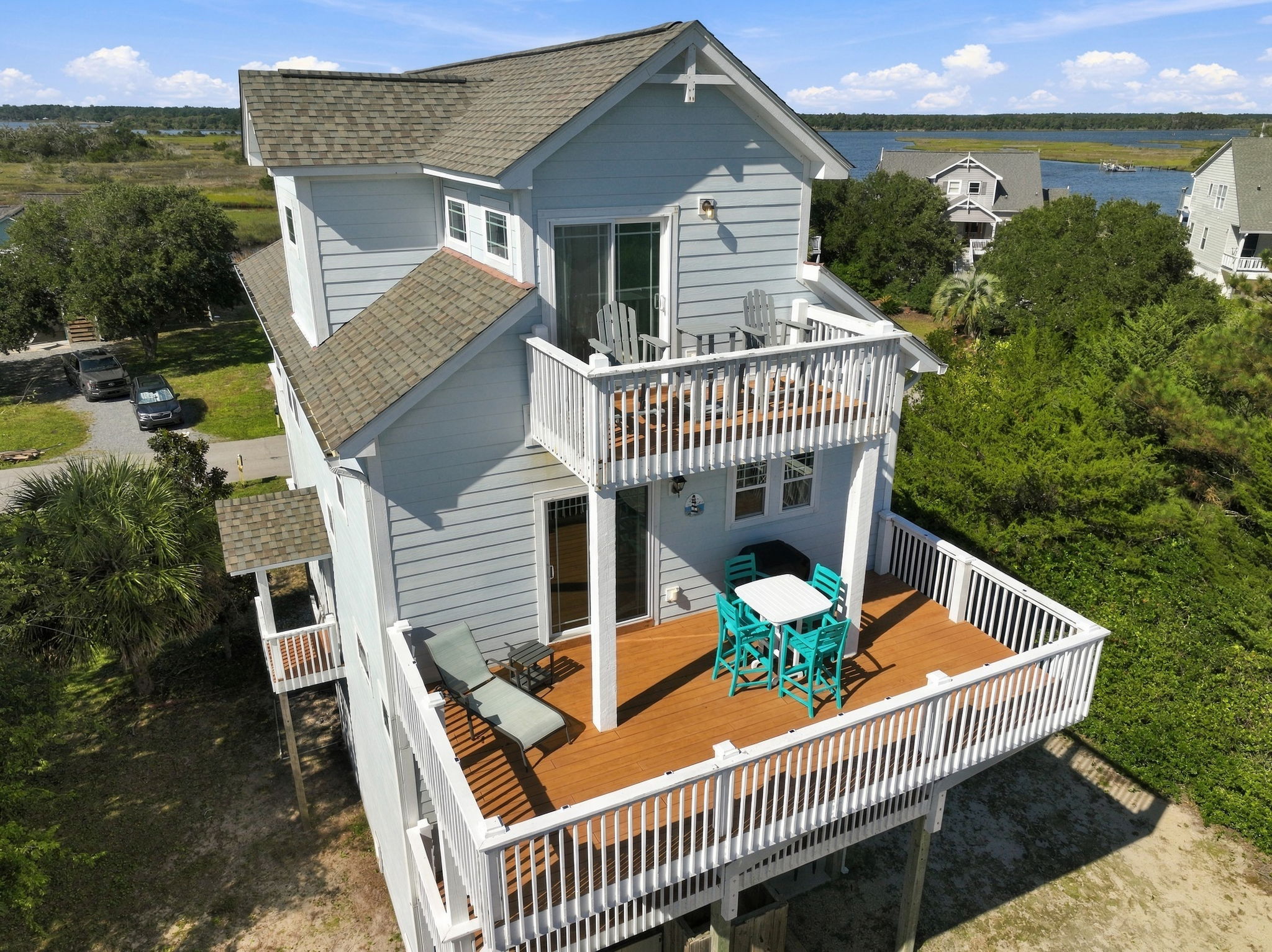 Spacious outdoor decks with multiple seating areas, perfect for relaxing and entertaining