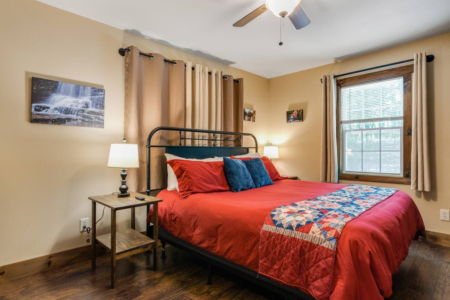 King-size bed in back bedroom with blackout curtains