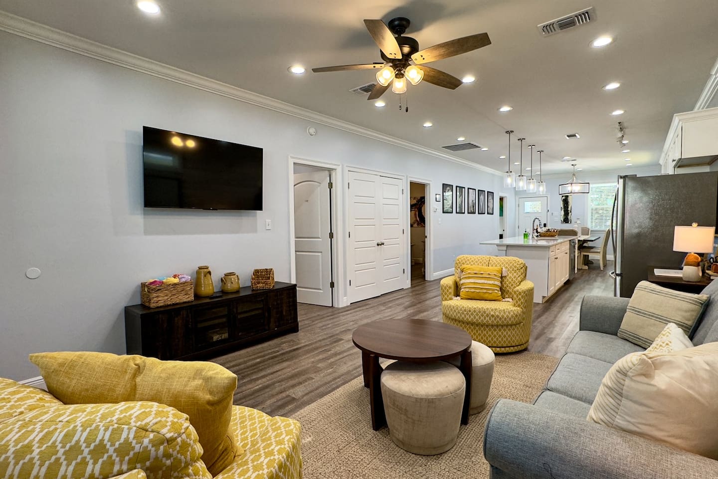 Where sleek design meets cozy charm—living room and kitchen in harmony