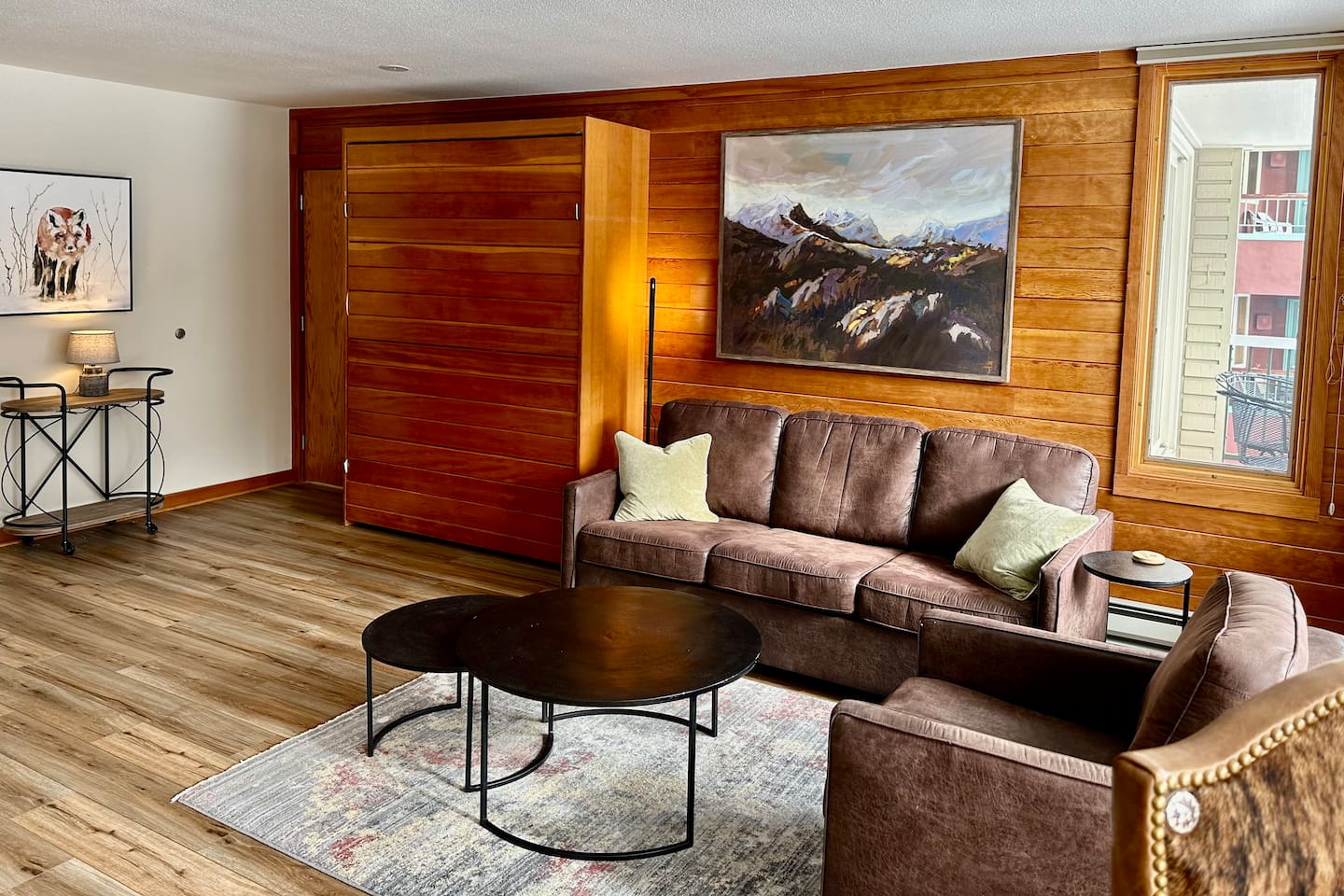 Another view of the living room with murphy bed in up position