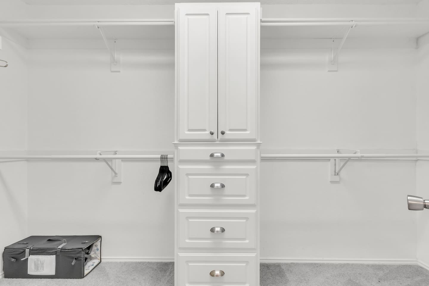 Spacious walk-in closet with ample hanging space, hangers provided, and room to comfortably unpack during your stay.