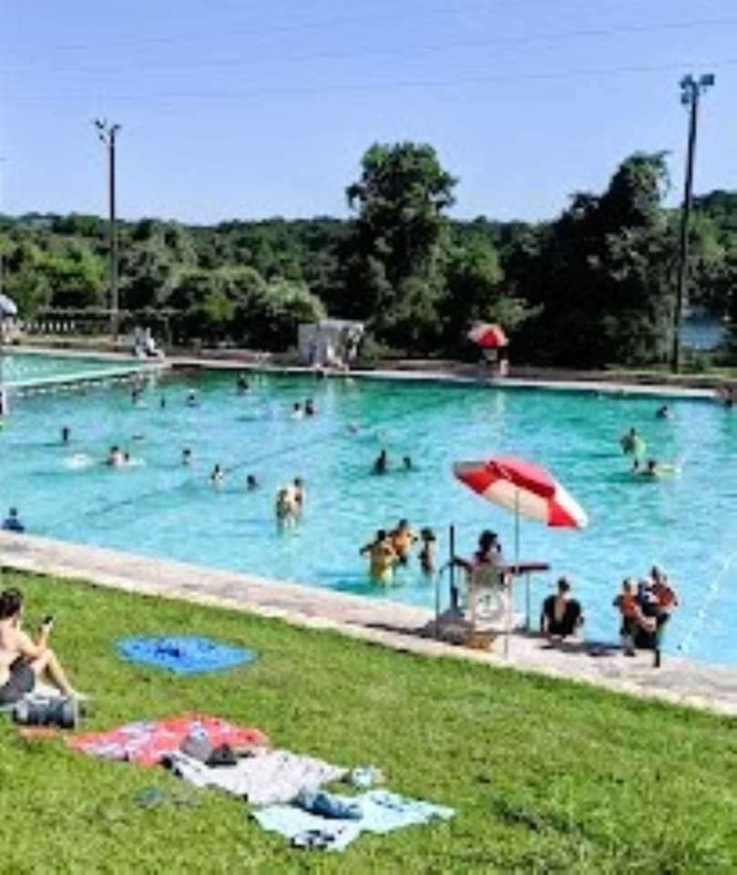 This Spring Fed Pool is Near the Lady Bird Hike and Bike Trail And Is Just A Ten Minute Drive From the House.   The Pool Features a Beach End, a Designated Lap Swim Area, A Bath House and Beverage and Snack Bar
