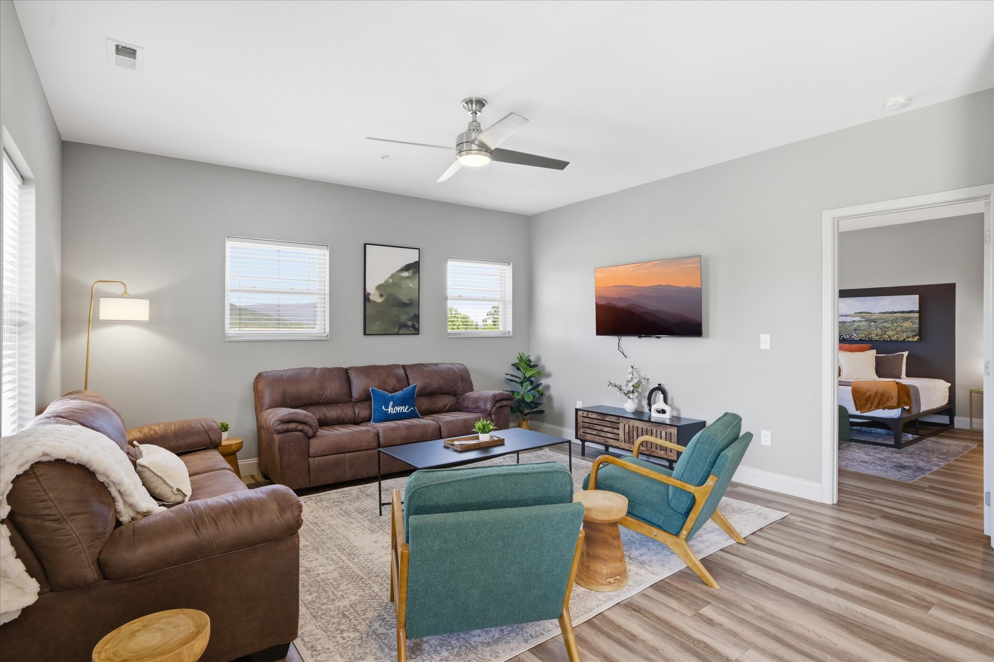 From this angle, you can see how open it really is—Unit 3 gives you extra space to spread out, with comfortable seating and a TV that keeps the room anchored for downtime.