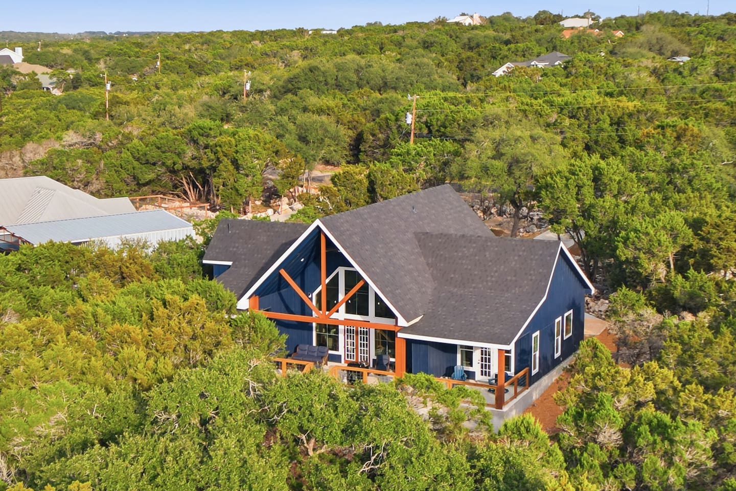 Dragonfly Ridge Estate surrounded by mature trees, offering privacy and space between Canyon Lake and Gruene.