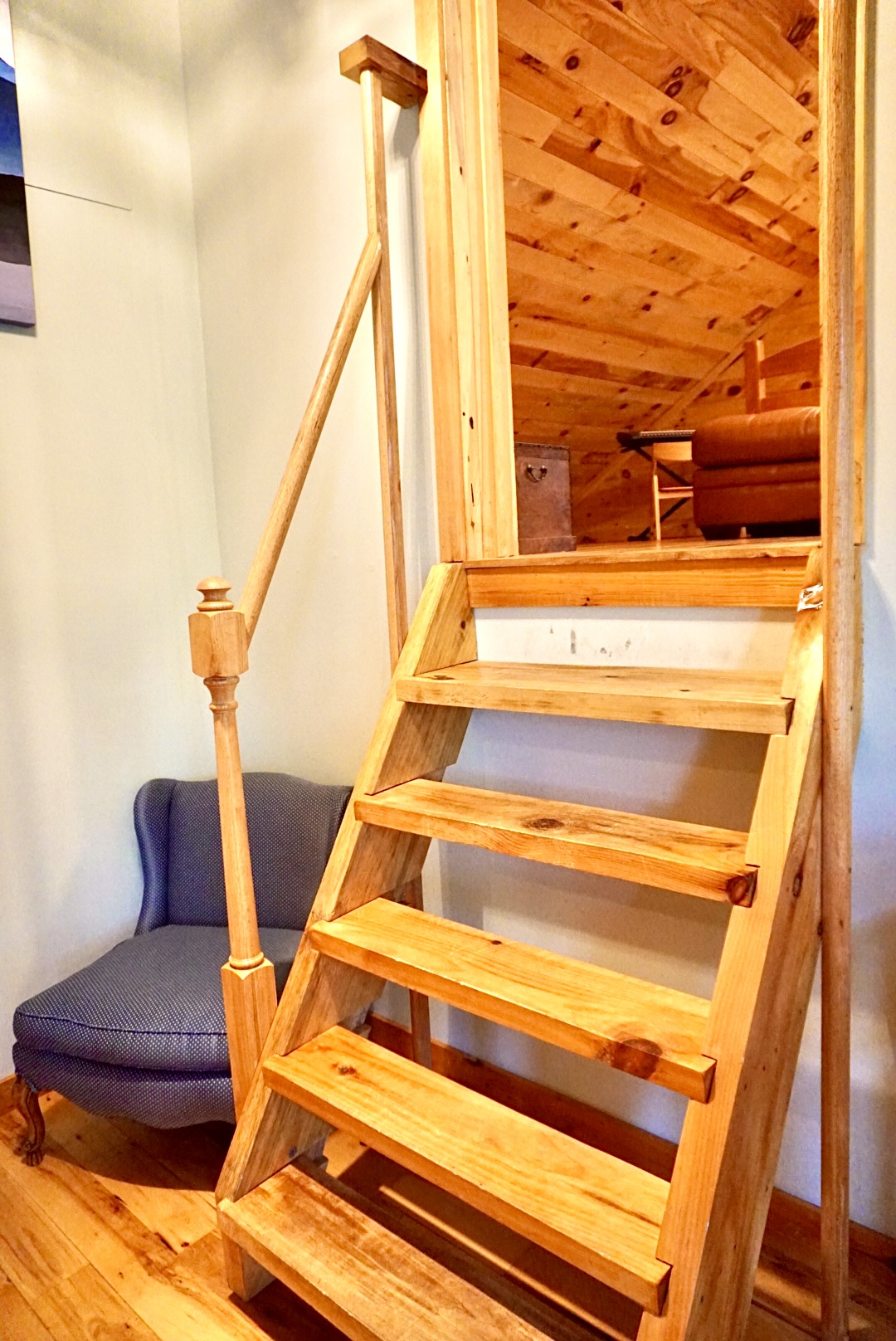 Loft Access: Ascend the charming wooden stairs to discover a serene retreat above!