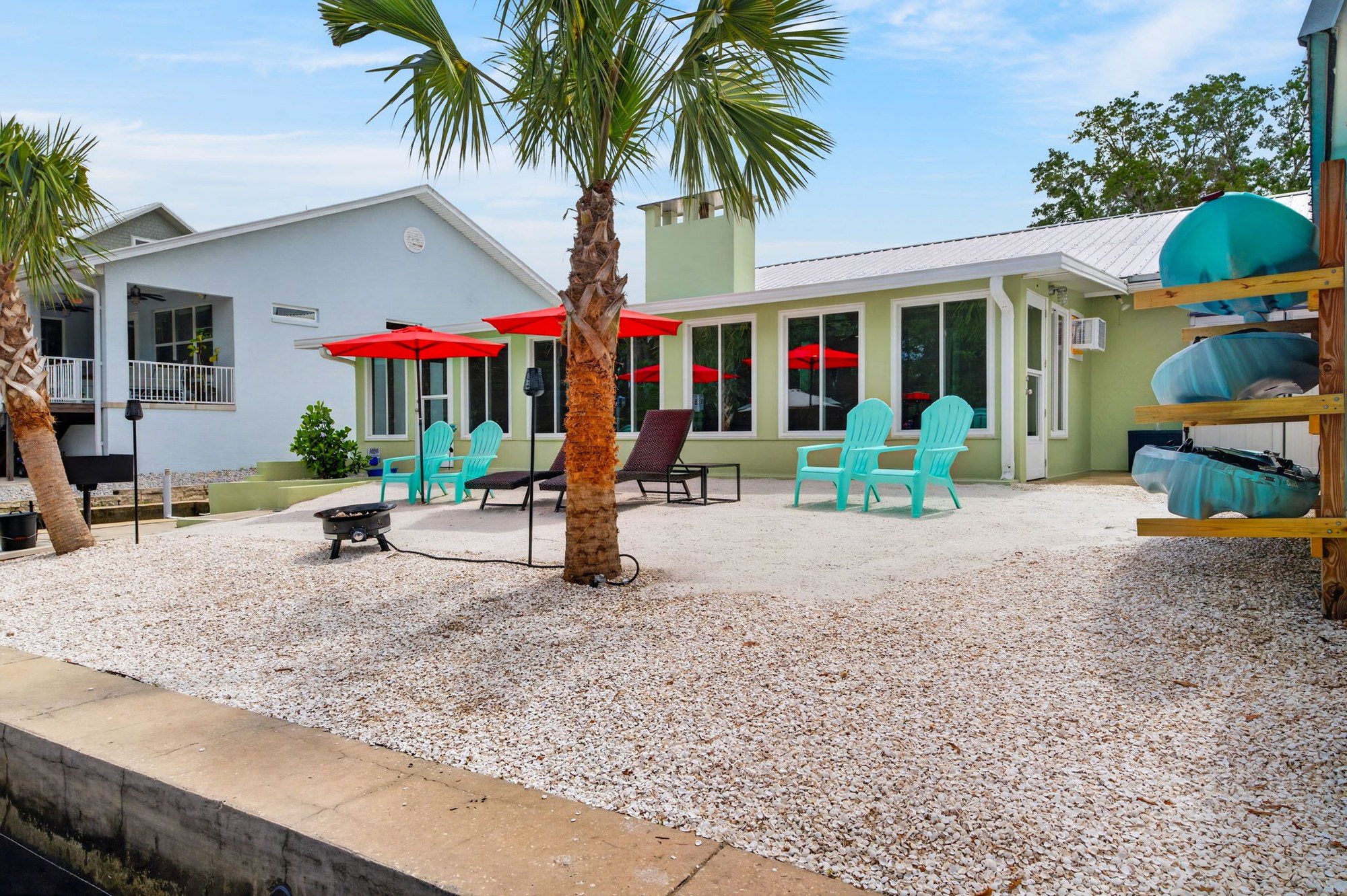 Back yard seating with palm tree