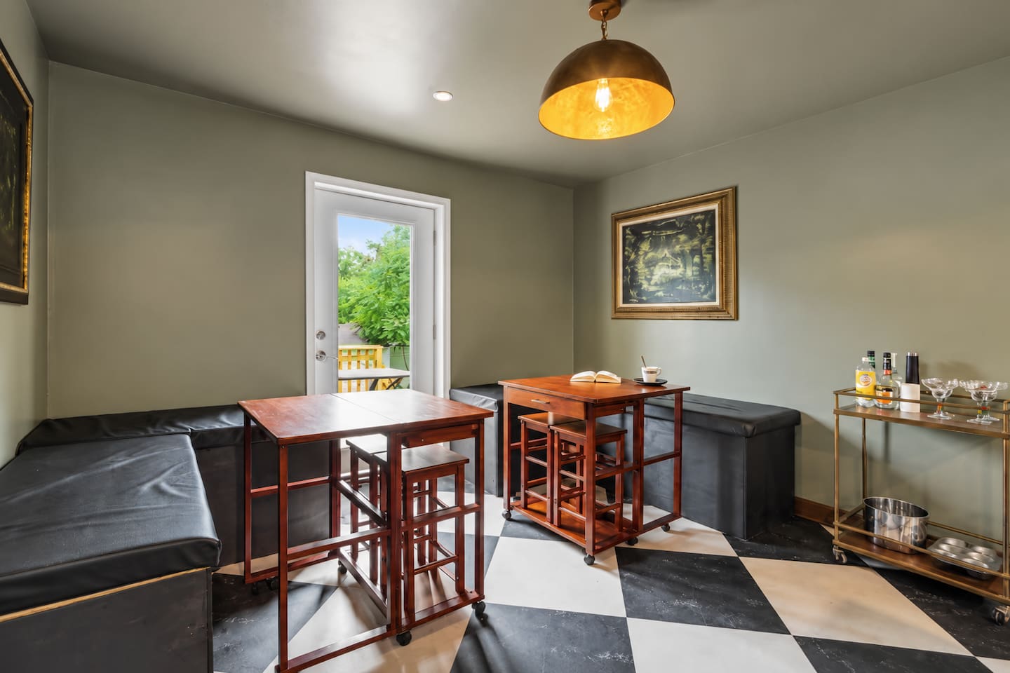 Cozy dining space featuring bar-height seating, a comfortable lounge area, and a stylish setup perfect for enjoying meals or drinks.