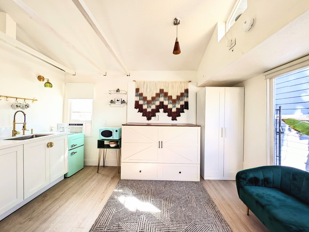 Queen Murphy bed folds away to maximize space.