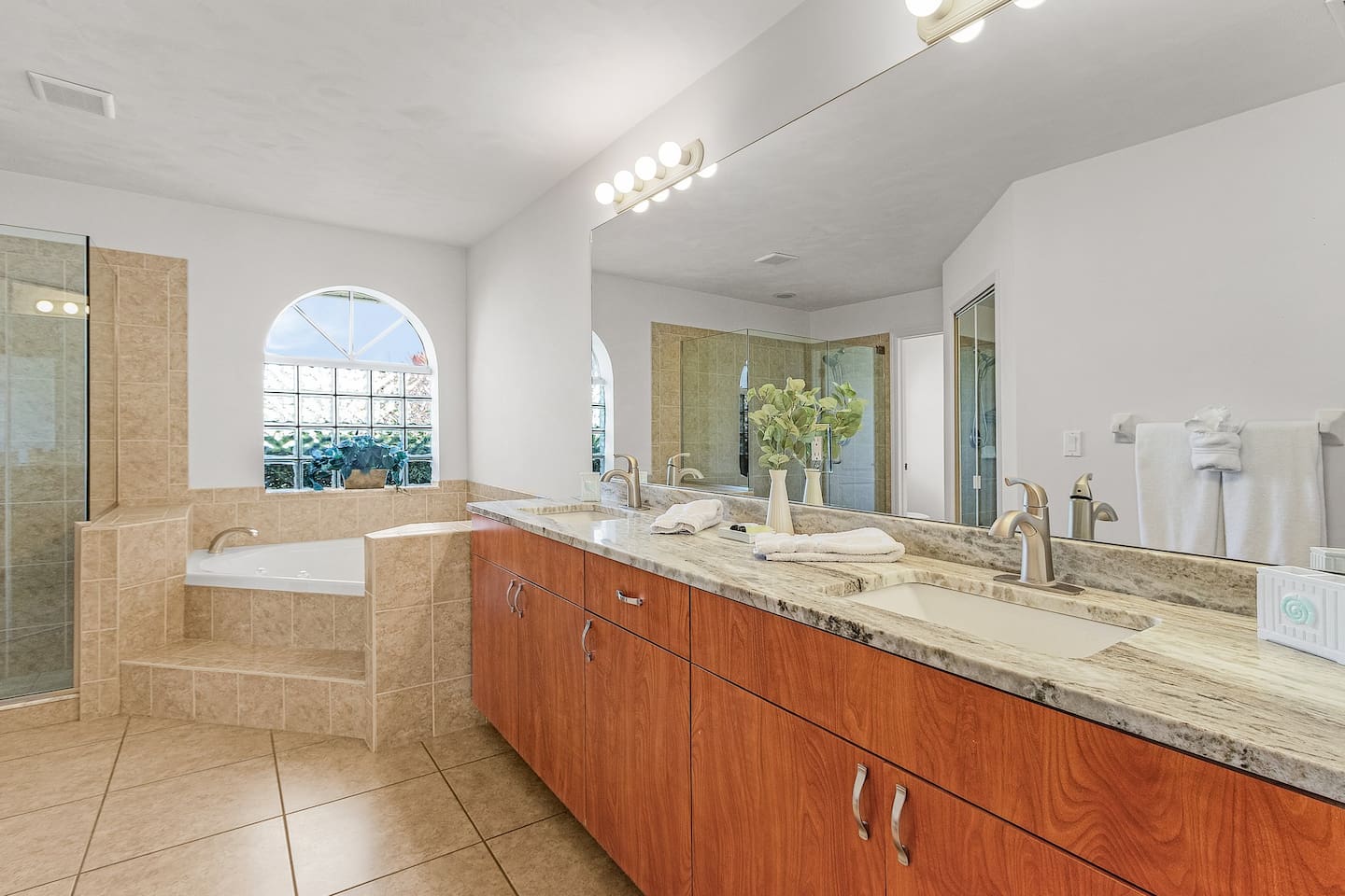 Primary bathroom with a dual vanity, offering ample space and comfort!