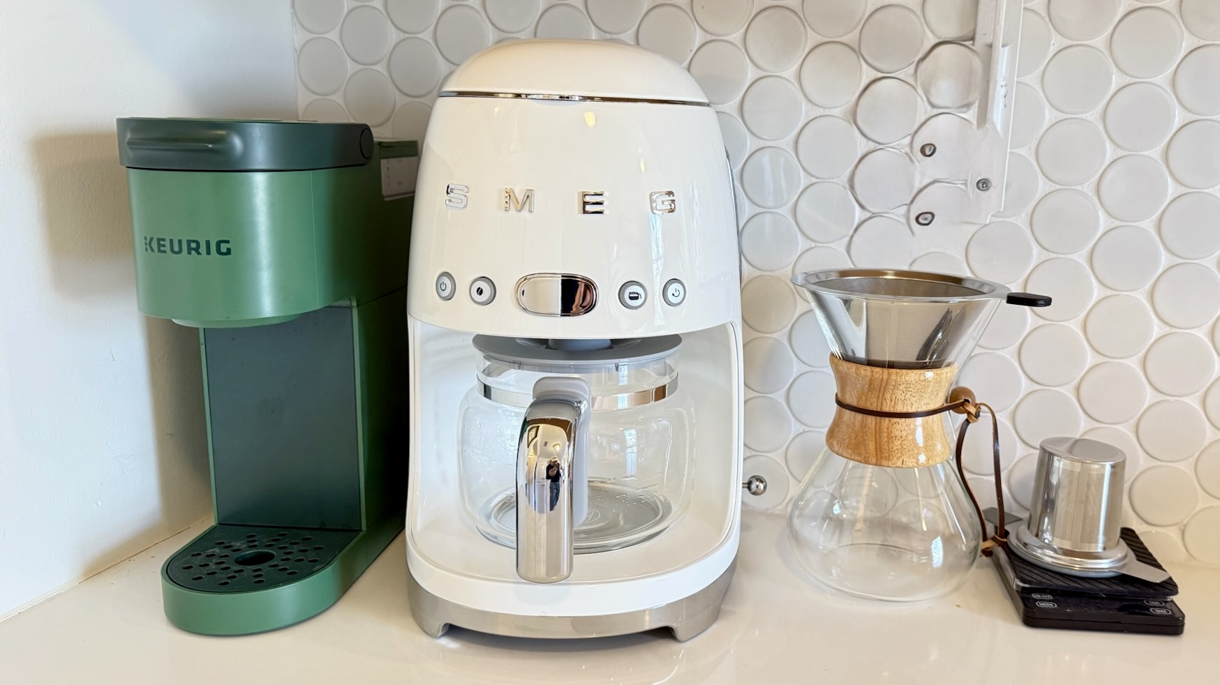 Well-equipped coffee station with Keurig, SMEG drip brewer, and pour-over setup for every coffee preference.