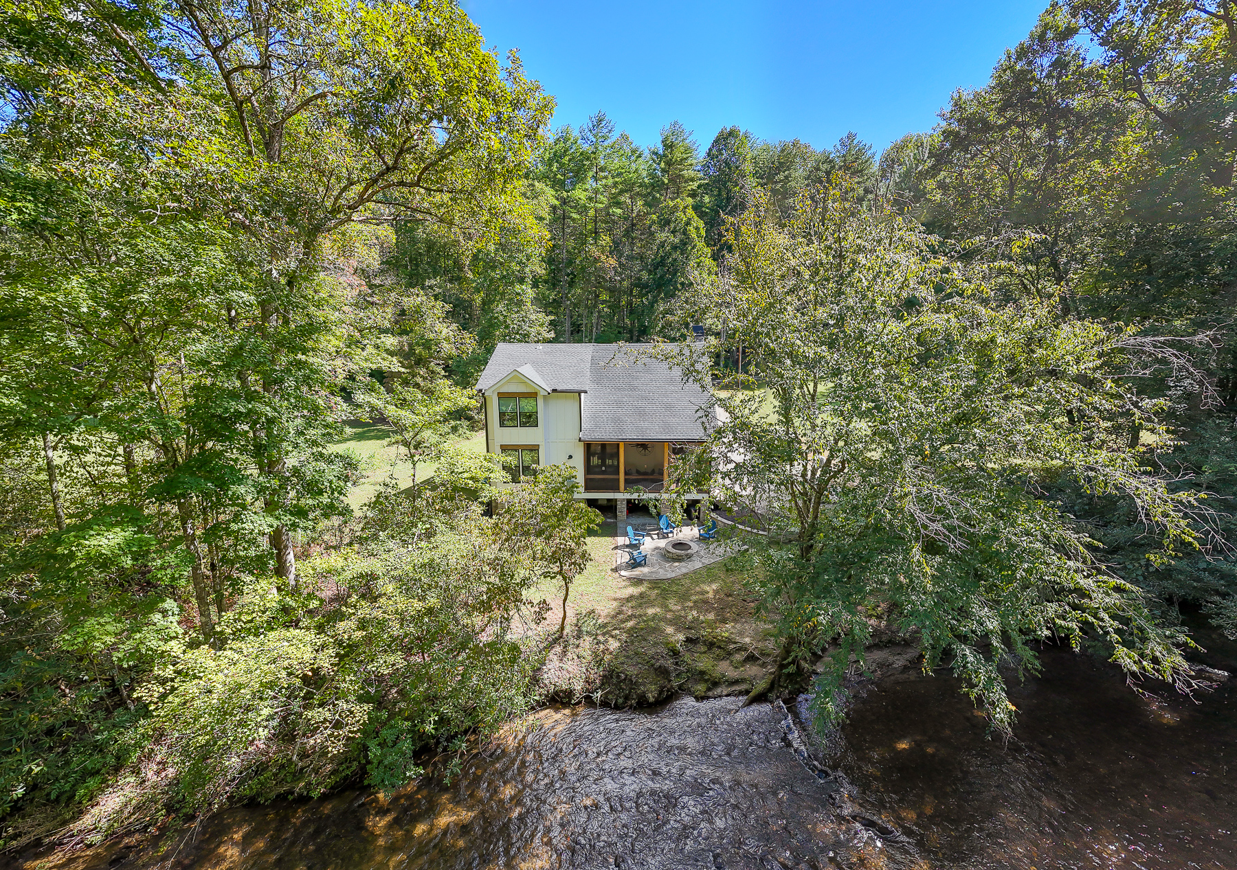 Tucked among the trees, Robbin’s Nest on Snowbird Creek offers a peaceful setting with a creekside fire pit for evenings outdoors.