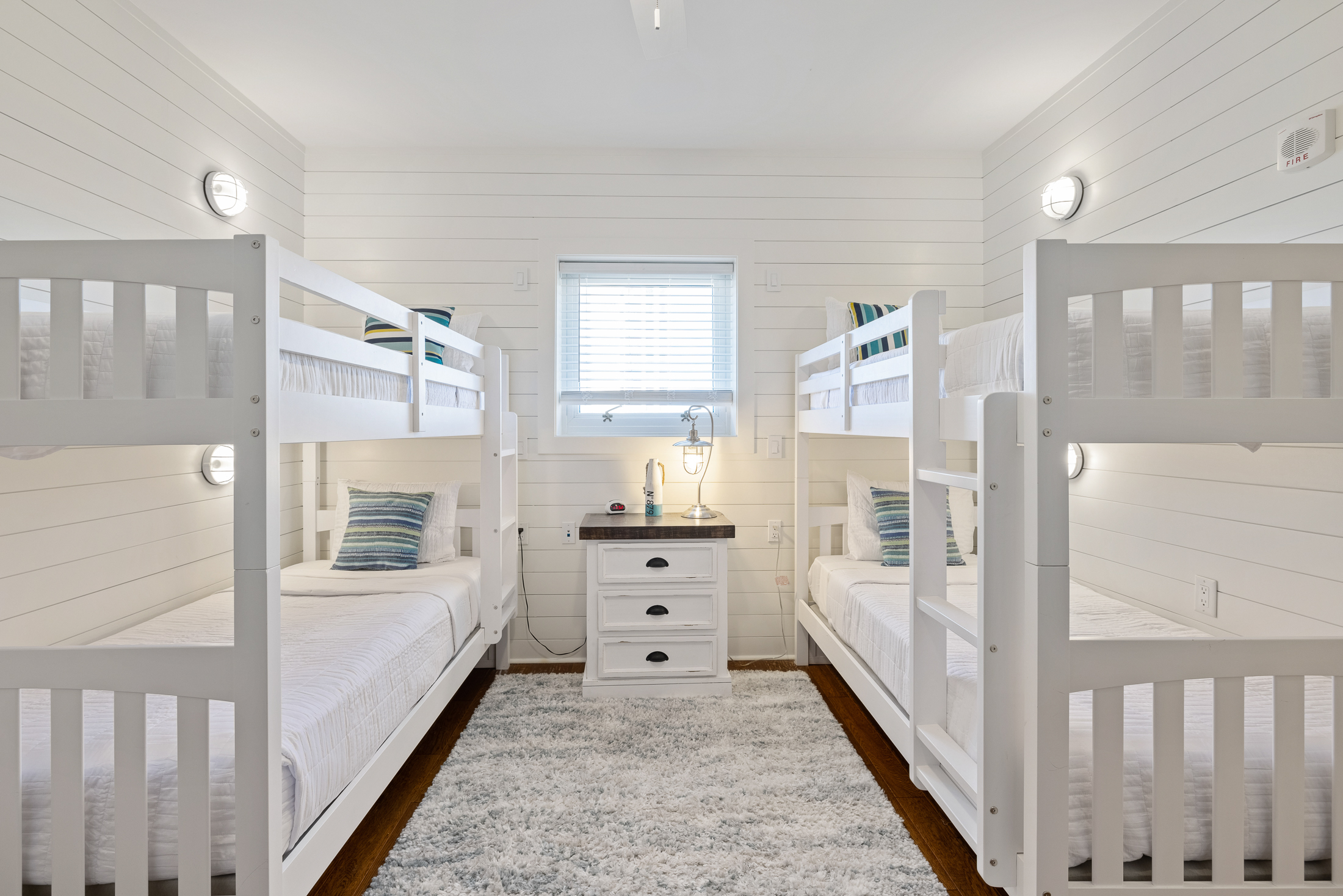An awesome bunk room down with individual lights and charging at each bunk.