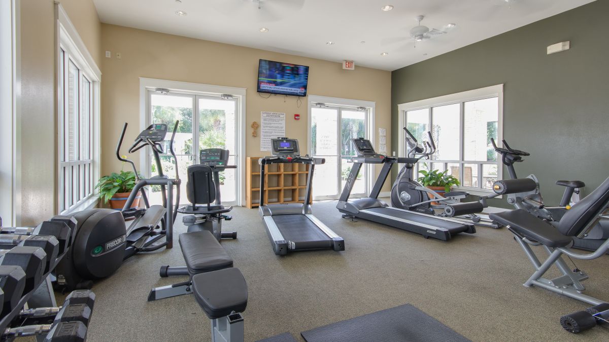Pilot House fitness room with treadmills, ellipticals, weight machines and free weights