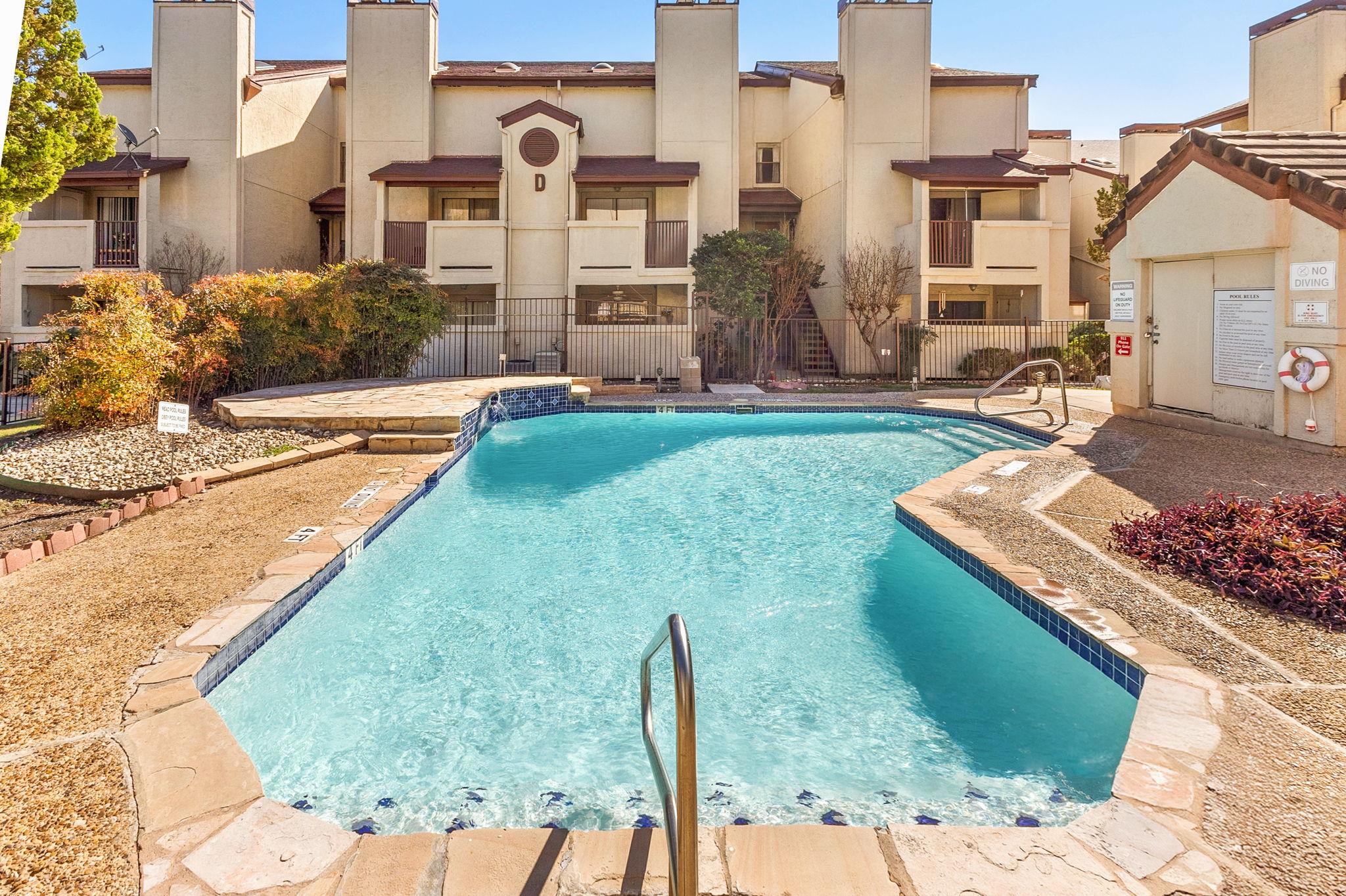 Resort-style community pool with lounge chairs – cool off after sightseeing without leaving the property