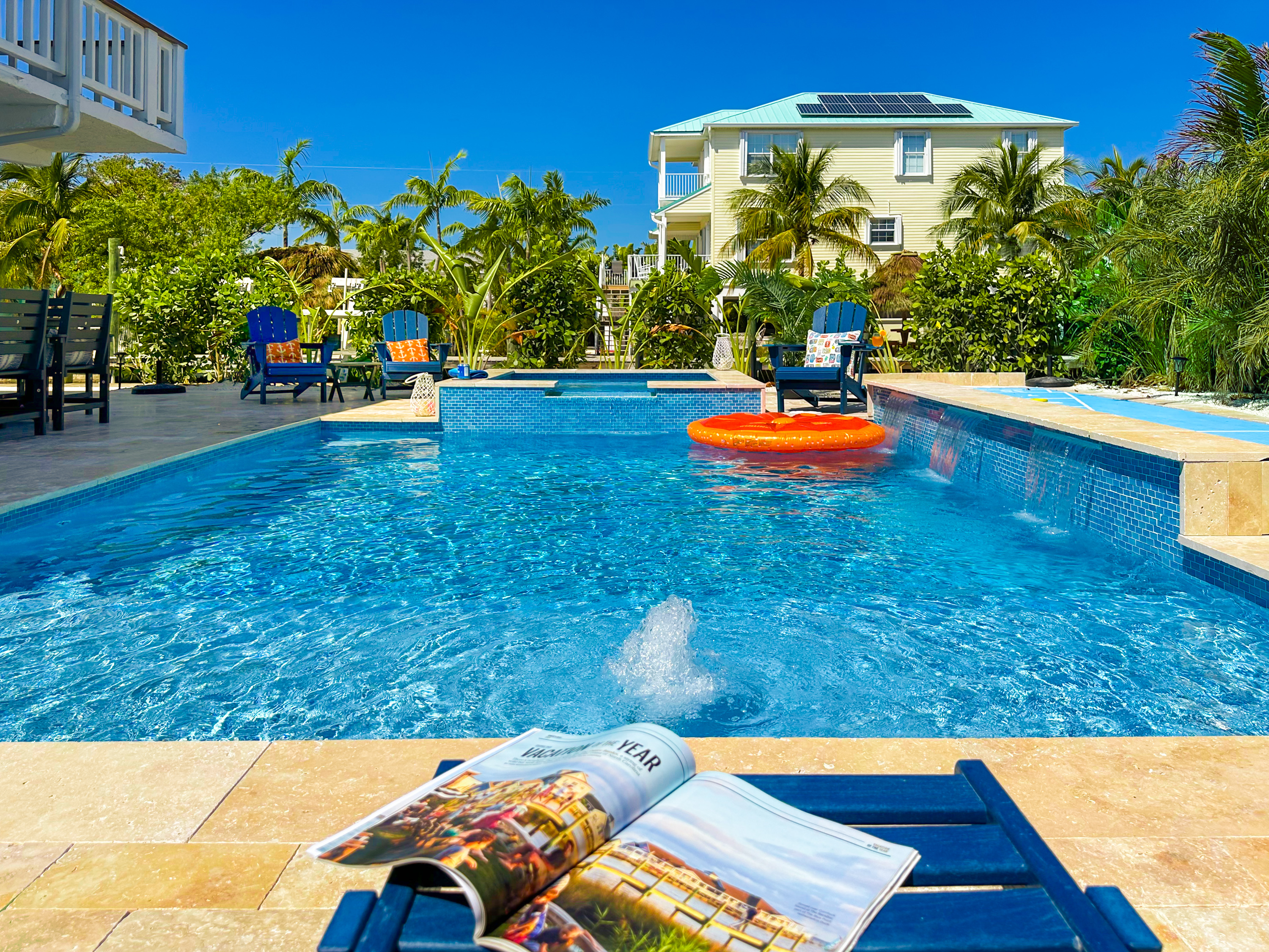 Take a refreshing dip in the pool with a waterfall feature.