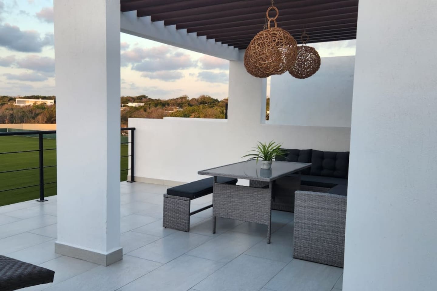 Rooftop terrace seating area facing the soccer field 