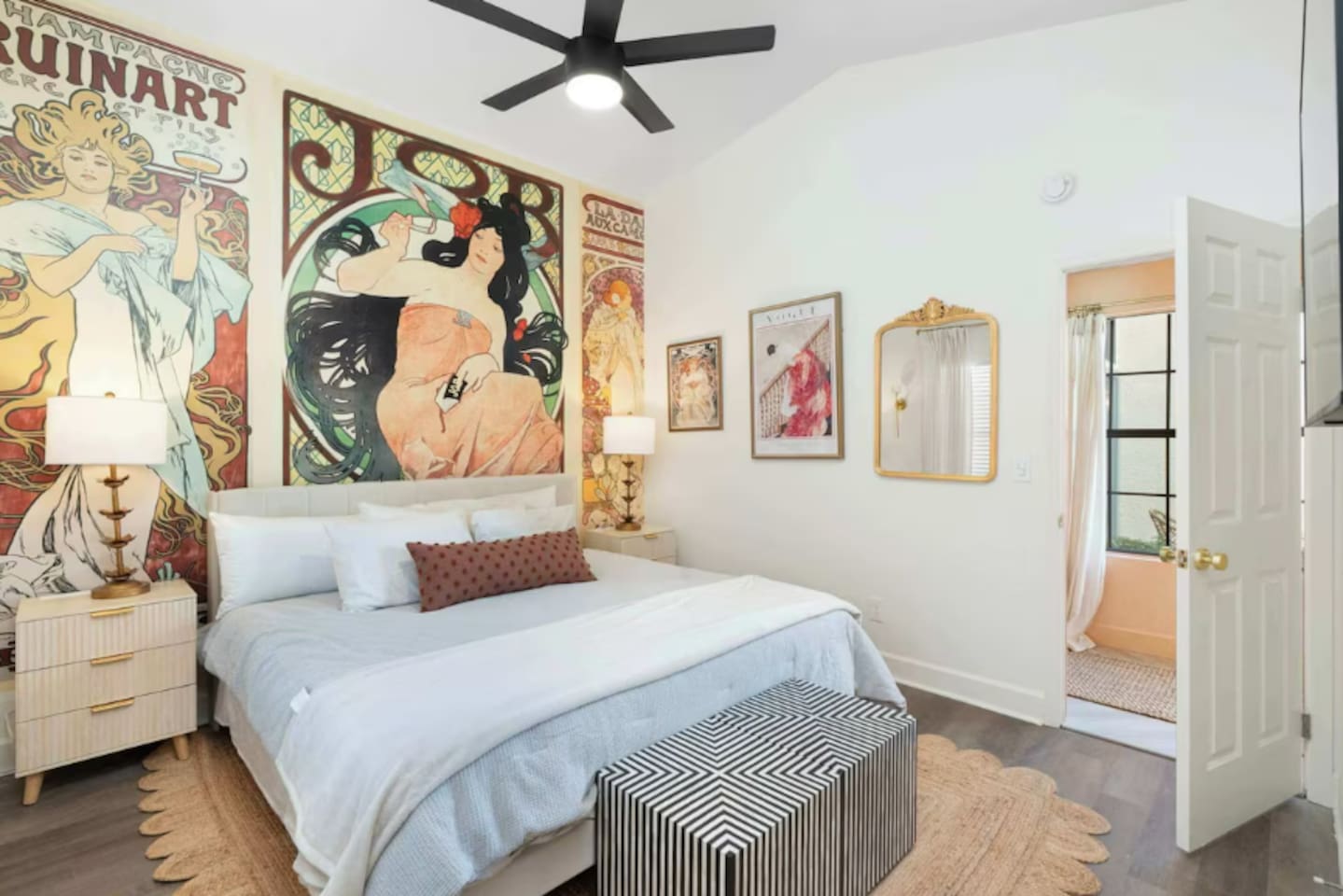 Custom artwork set the cozy tone for this king bedroom.