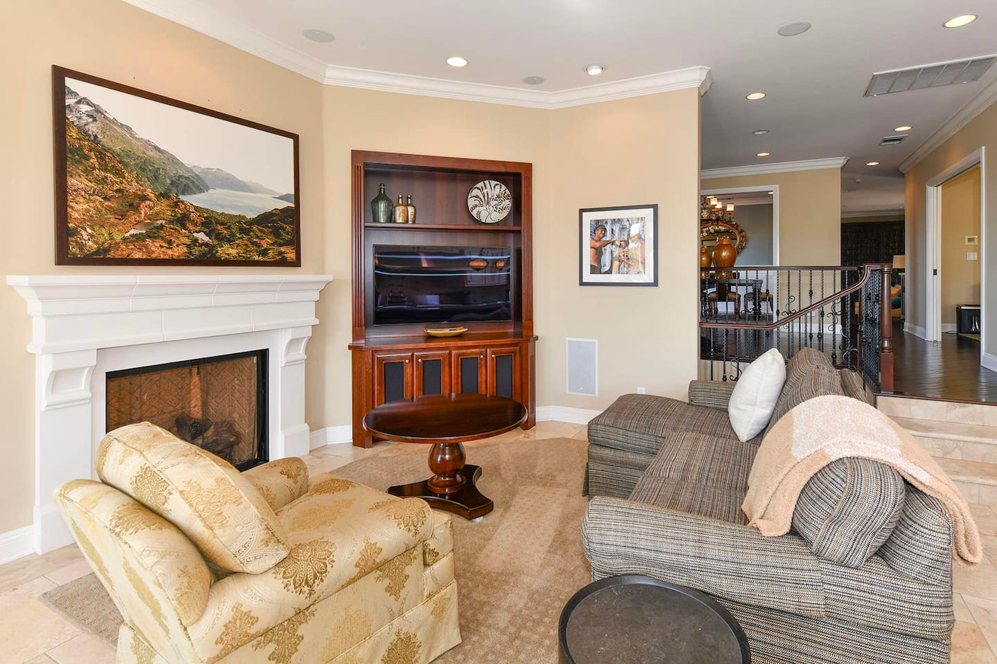 Living area with smart tv next to the kitchen.