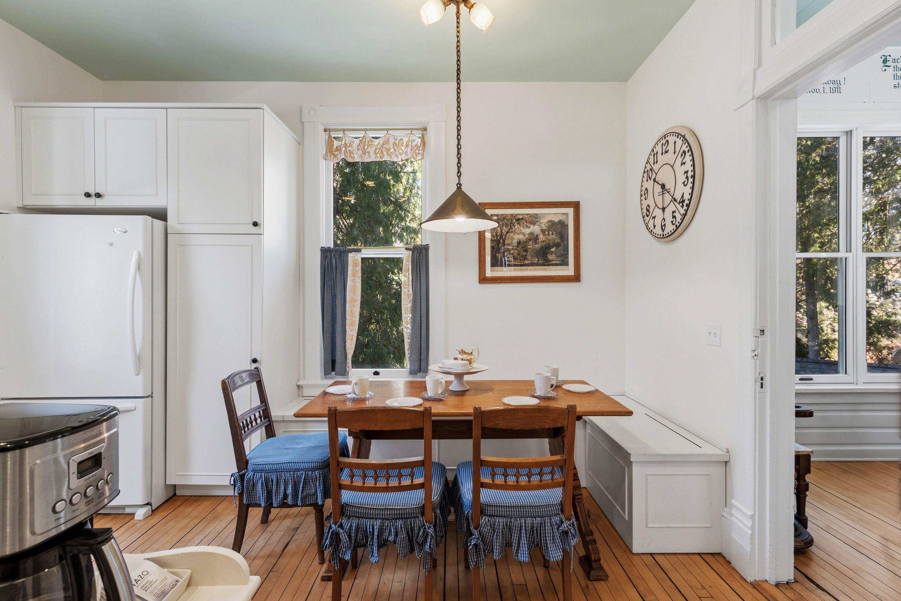 Kitchen dining area w/ table set for shared meals
