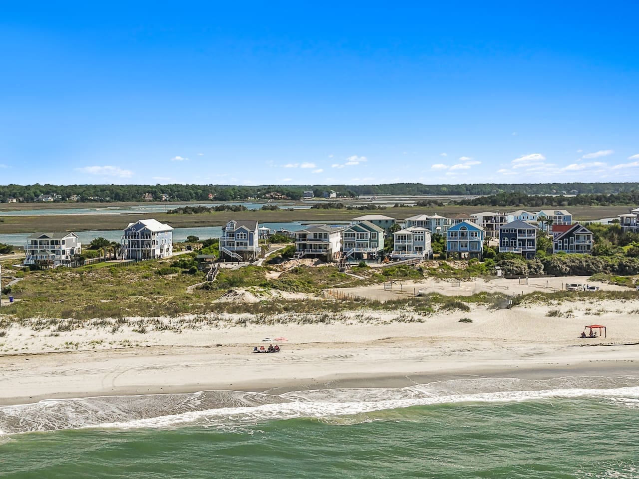 Pack a little lighter - we've got the beach essentials covered! Guests will enjoy complimentary beach chairs, towels, a cooler, TWO beach umbrellaS, Shibumi shade, sand toys, and a TWO wagons to make trips to and from the beach easy and enjoyable.