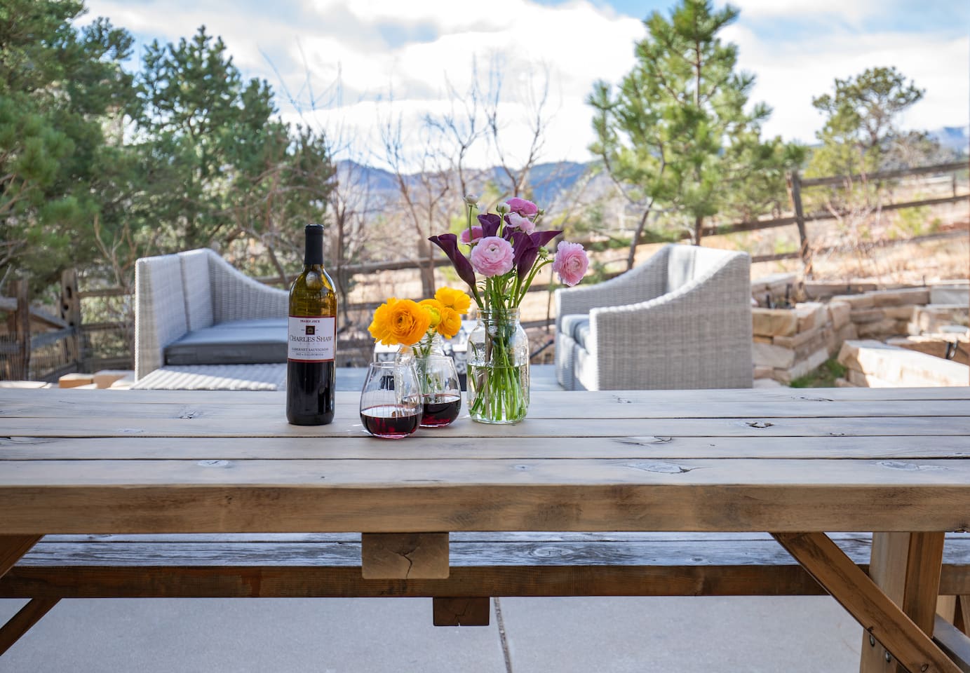 Enjoy meals al fresco at the backyard dining table, perfectly shaded under a charming pergola—ideal for morning coffee or evening dinners under the stars.”