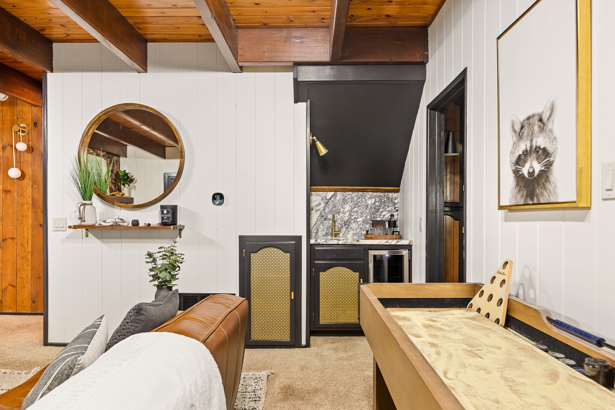 In one corner, you'll find a mini bar where you can enjoy your favorite cocktail or glass of wine while connecting with friends and family.