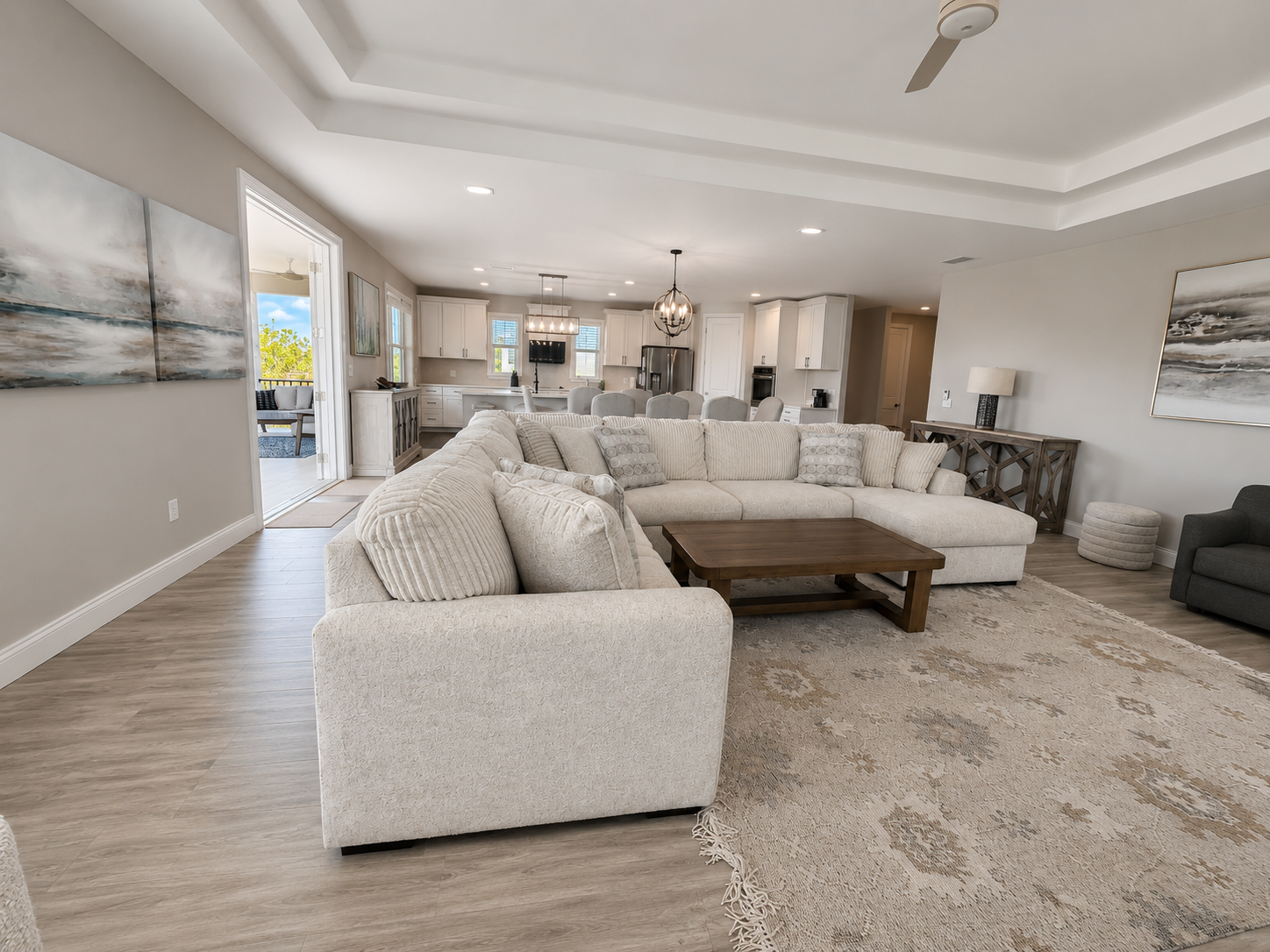 Sunlight, sea breezes, and space to gather—this open great room flows from sofa to table to the balcony beyond. Throw the doors wide, let the indoors and out become one, and watch the whole family drift happily between them all day long.