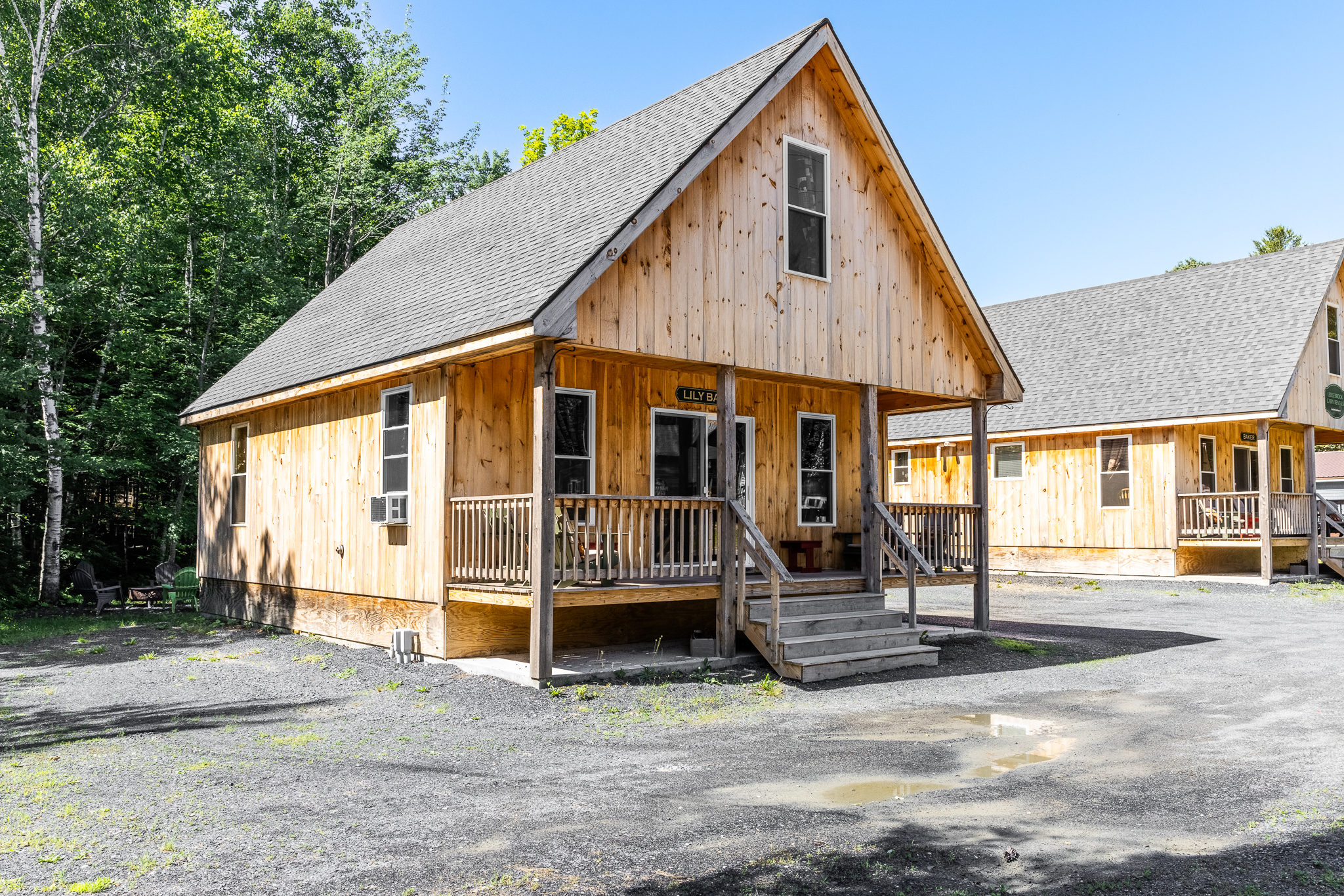 Front porch with Adirondack chairs to relax with access to restaurants and shops.