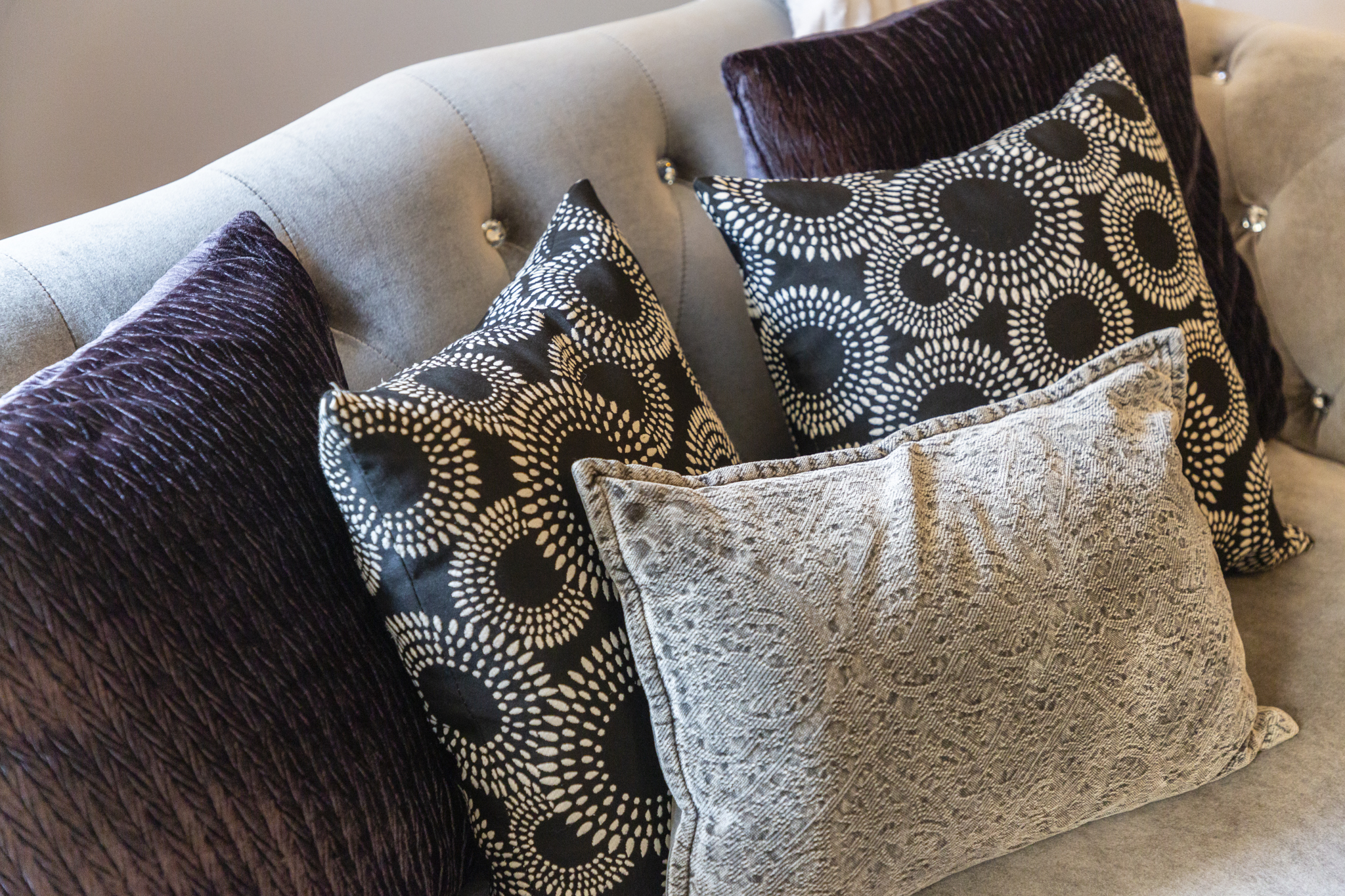 Soft textures and cozy details make the living room feel warm and inviting.