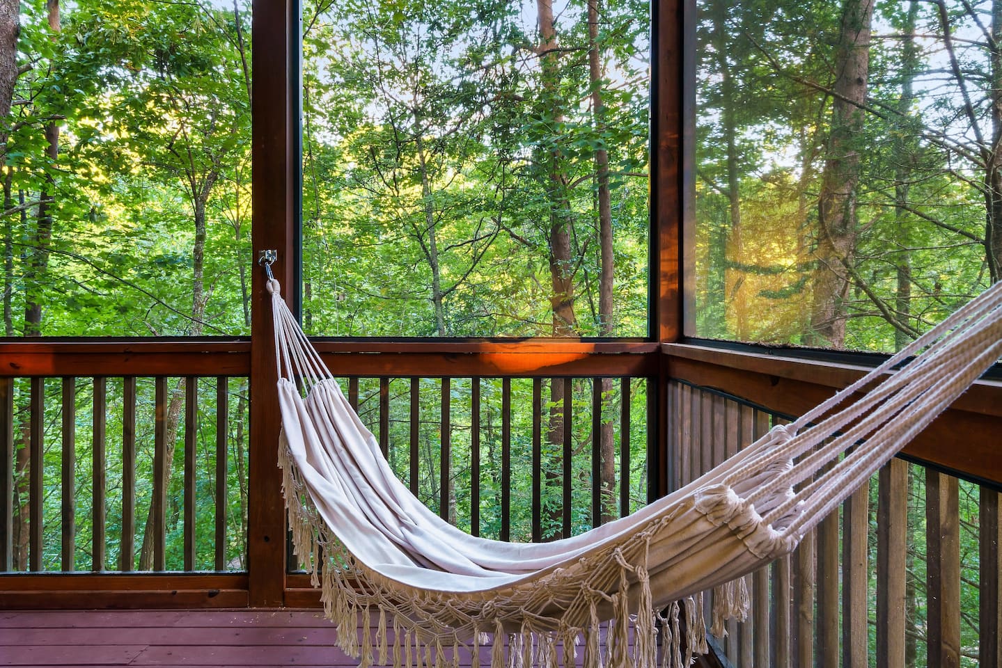 Enjoy the mountain air from a relaxing hammock on our screened in deck