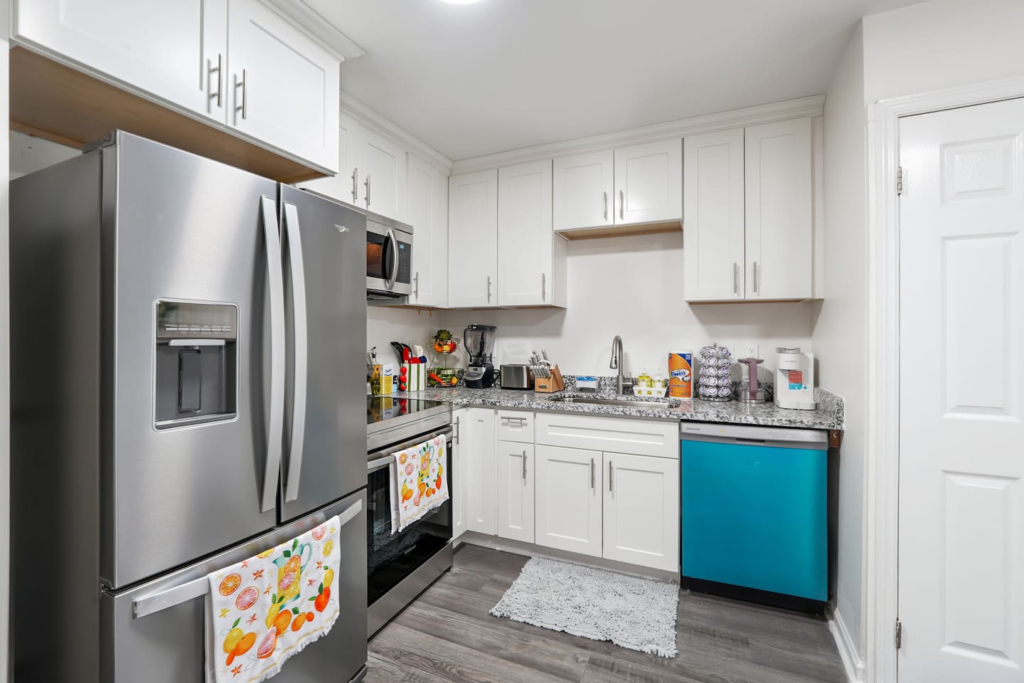 Full kitchen thoughtfully stocked with everything you may need including cookware, utensils, dishes, and essential appliances perfect for preparing meals and enjoying a true home-away-from-home experience.