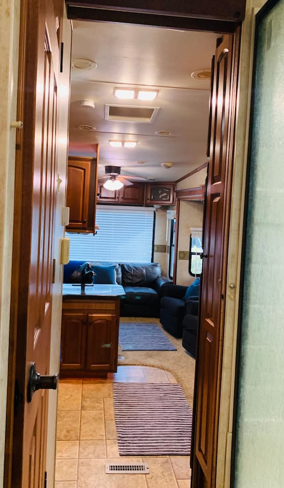 Between bedroom and kitchen/living room.