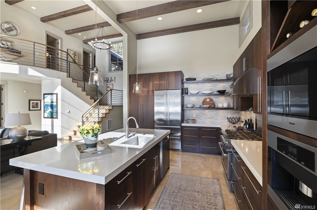 High-end modern kitchen with sleek appliances and ample amenities for cooking and entertaining.