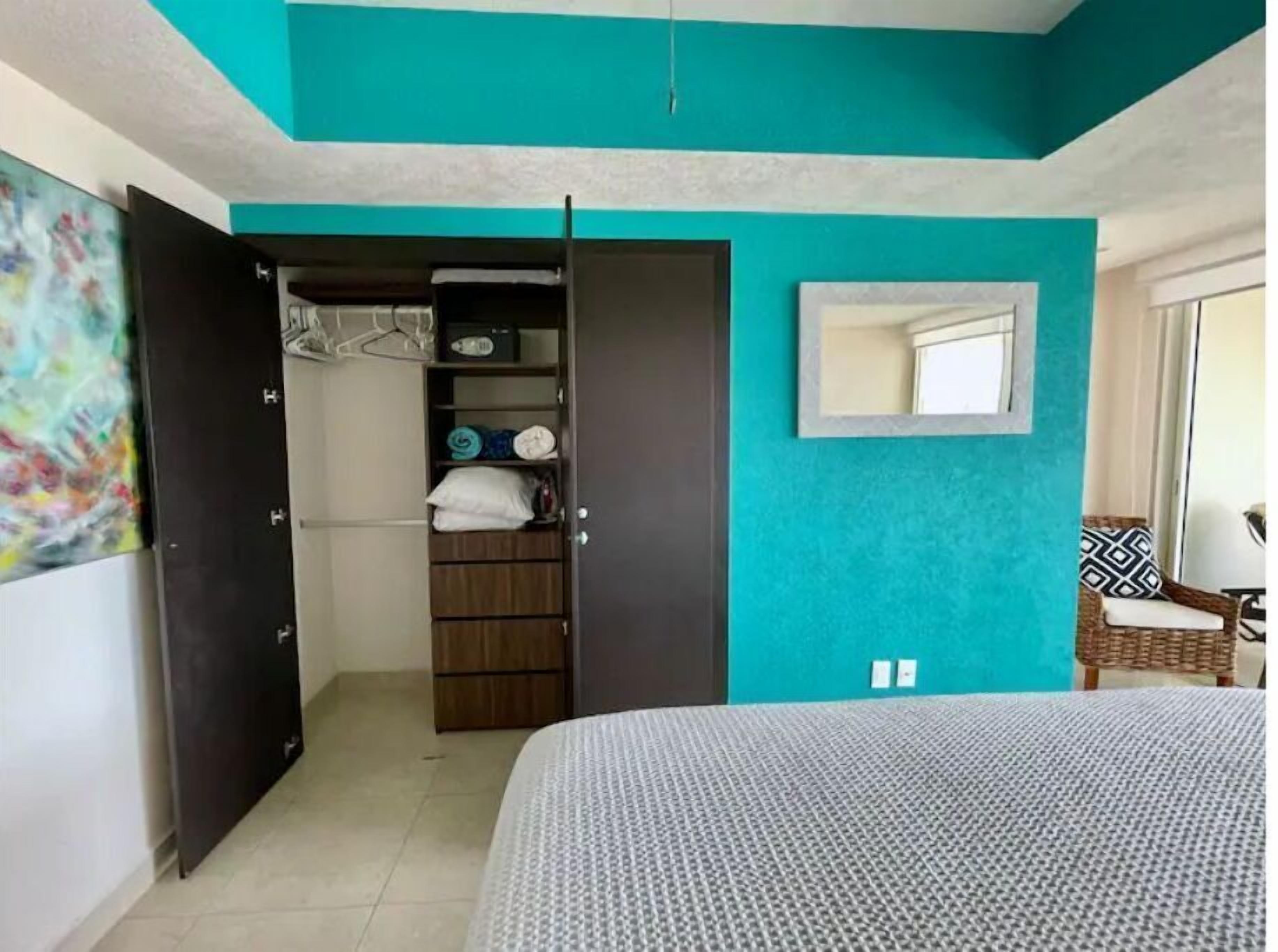 Closet in master bedroom with extra pillows