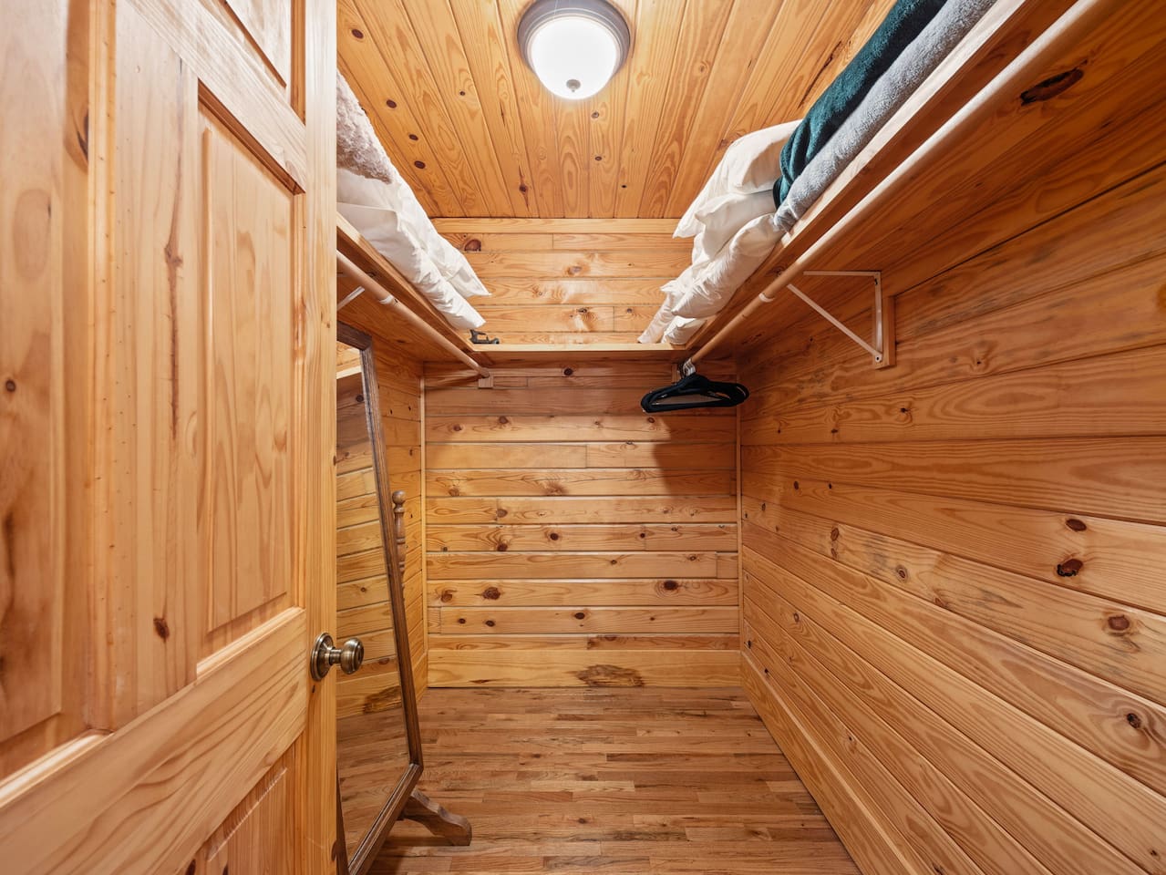 Primary bedroom walk-in closet